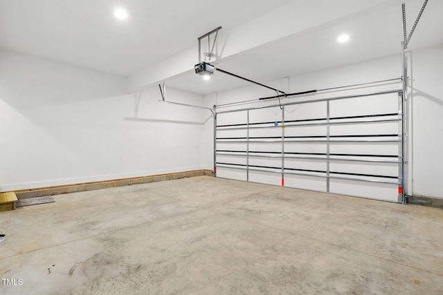 8629 Dukes Lake Rd, Zebulon, NC 27597 - garage featuring a garage door opener and baseboards