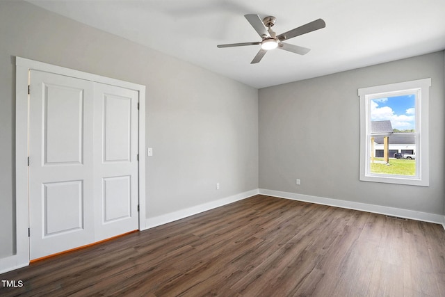 8629 Dukes Lake Rd, Zebulon, NC 27597 - unfurnished bedroom with dark wood-type flooring and a ceiling fan