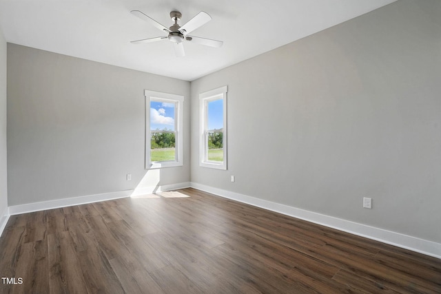 8629 Dukes Lake Rd, Zebulon, NC 27597 - empty room with dark wood-style flooring and a ceiling fan