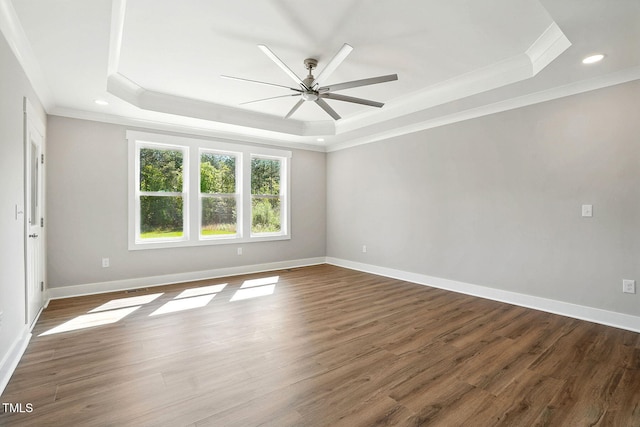 8629 Dukes Lake Rd, Zebulon, NC 27597 - spare room featuring a raised ceiling, crown molding, ceiling fan, wood finished floors, and recessed lighting
