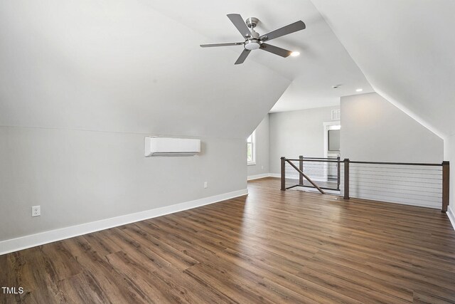 8629 Dukes Lake Rd, Zebulon, NC 27597 - additional living space featuring a wall unit AC, lofted ceiling, dark wood-type flooring, a ceiling fan, and recessed lighting