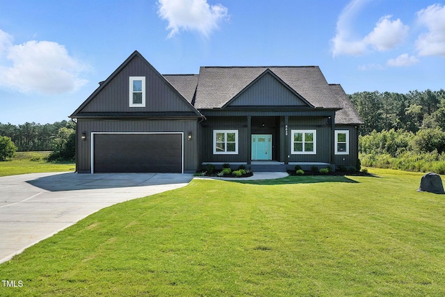 8629 Dukes Lake Rd, Zebulon, NC 27597 - modern inspired farmhouse with driveway, a garage, a front lawn, and roof with shingles