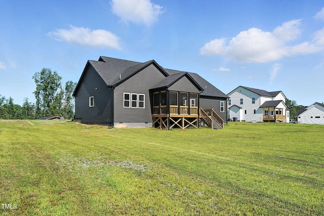 8629 Dukes Lake Rd, Zebulon, NC 27597 - back of property with a sunroom, a lawn, and crawl space