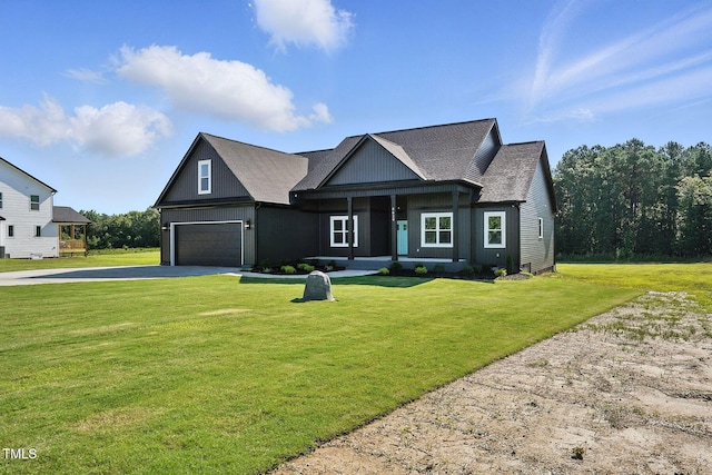 8629 Dukes Lake Rd, Zebulon, NC 27597 - view of front of property with driveway, a front yard, roof with shingles, and a porch