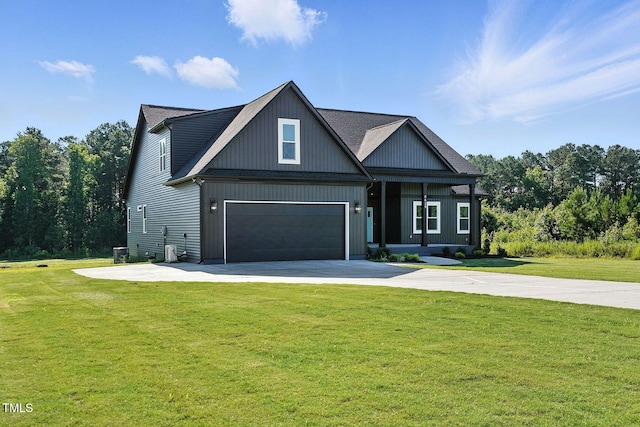 8629 Dukes Lake Rd, Zebulon, NC 27597 - craftsman house featuring driveway, a front lawn, and a garage