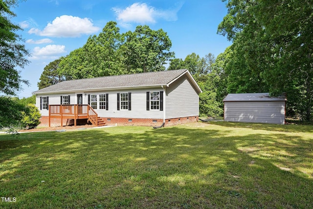 rear view of property featuring a yard, crawl space, a wooden deck, and roof with shingles