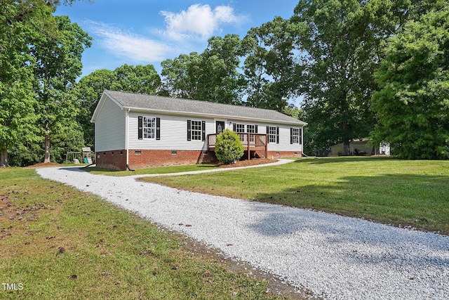 ranch-style house with a front lawn, driveway, and crawl space