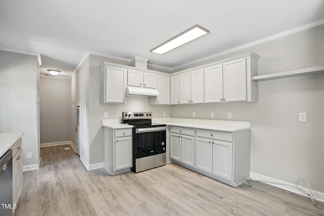 kitchen with light countertops, appliances with stainless steel finishes, ornamental molding, and light wood-type flooring
