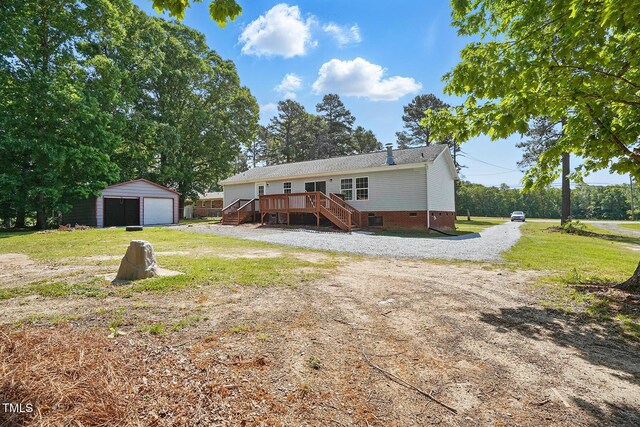 view of front of house with an outdoor structure, a deck, crawl space, stairway, and a detached garage