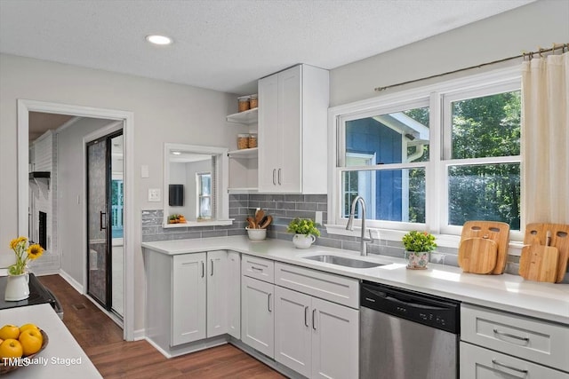 5124 Lazywood Ln, Durham, NC 27712 - kitchen featuring dishwasher, open shelves, white cabinets, tasteful backsplash, and dark wood-style flooring