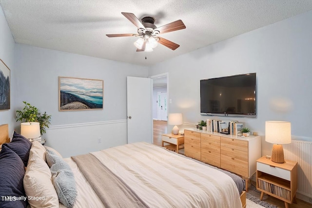 5124 Lazywood Ln, Durham, NC 27712 - bedroom with a textured ceiling and ceiling fan
