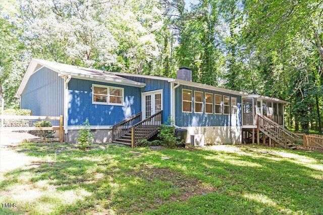 5124 Lazywood Ln, Durham, NC 27712 - ranch-style house featuring a chimney, a sunroom, stairway, crawl space, and french doors