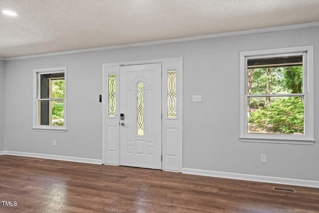 5124 Lazywood Ln, Durham, NC 27712 - entrance foyer with a textured ceiling, crown molding, and dark wood-type flooring