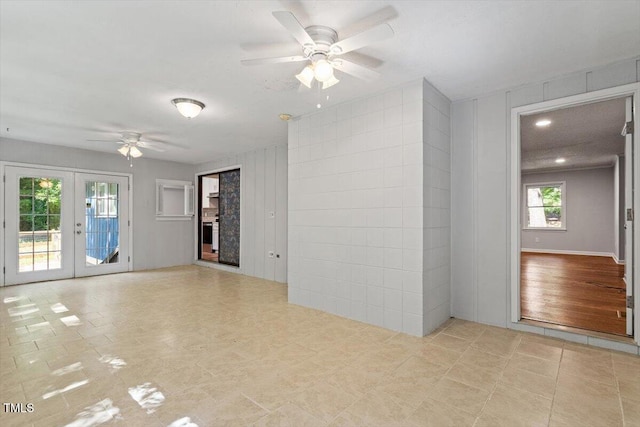 5124 Lazywood Ln, Durham, NC 27712 - unfurnished room featuring a ceiling fan and french doors