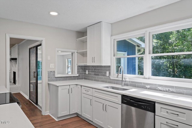 5124 Lazywood Ln, Durham, NC 27712 - kitchen featuring dishwasher, open shelves, plenty of natural light, white cabinets, and a textured ceiling