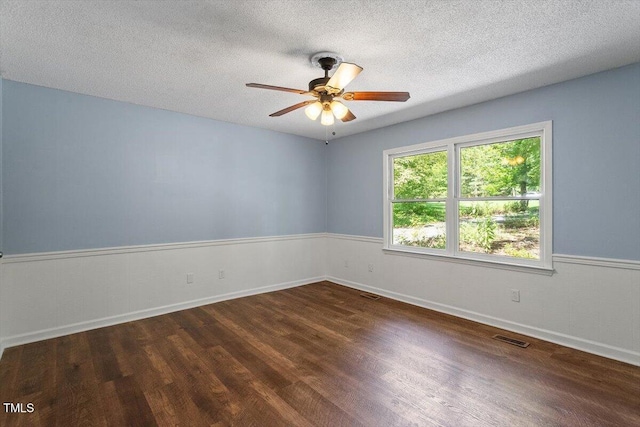 5124 Lazywood Ln, Durham, NC 27712 - spare room featuring ceiling fan, wood finished floors, and a textured ceiling
