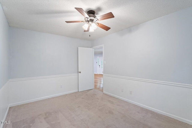 5124 Lazywood Ln, Durham, NC 27712 - unfurnished room with a ceiling fan, carpet flooring, and a textured ceiling