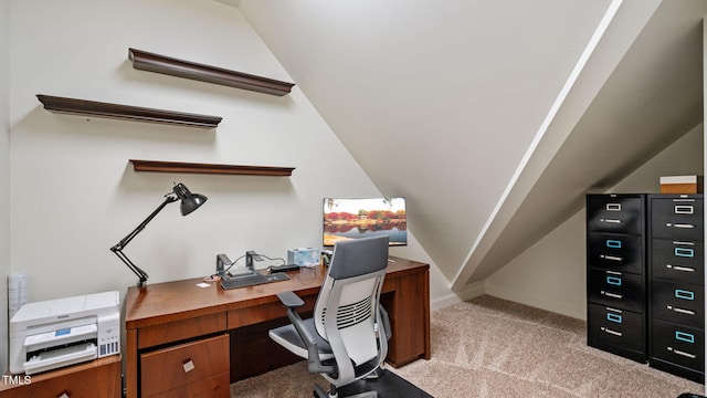 home office with light colored carpet, lofted ceiling, and baseboards