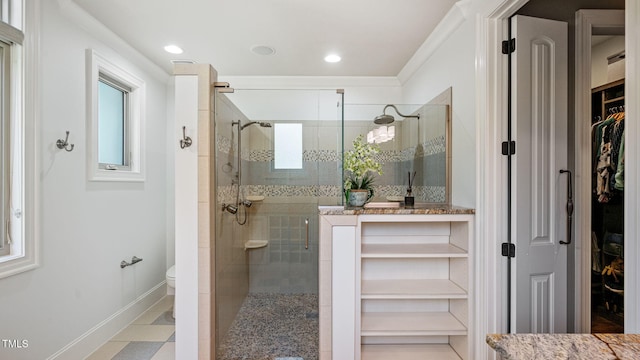 full bathroom with a stall shower, baseboards, toilet, a walk in closet, and recessed lighting
