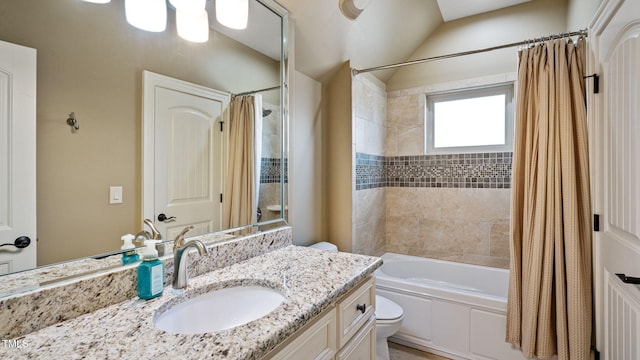 bathroom featuring toilet, shower / bath combo, and vanity