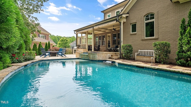 swimming pool featuring a patio area and a ceiling fan