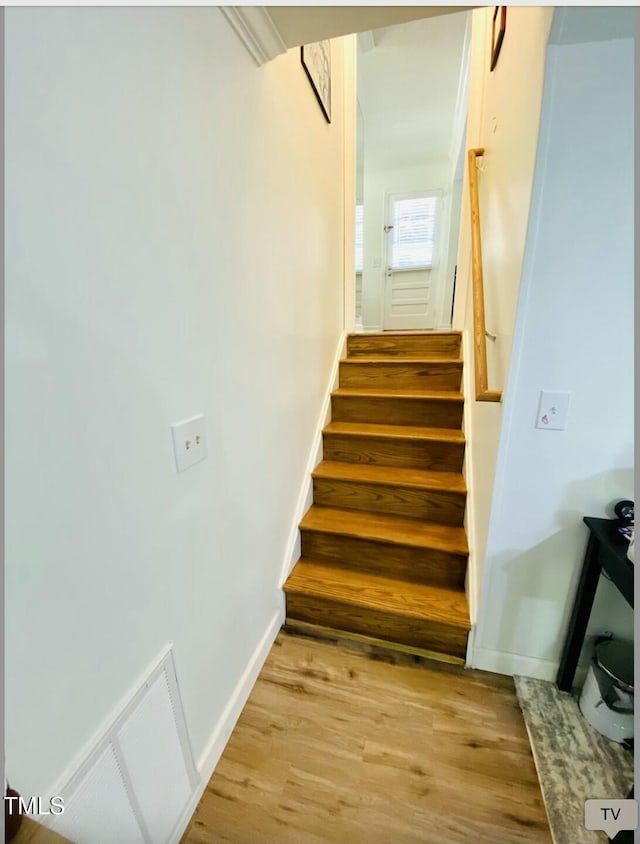 7412 Barberry Ct, Raleigh, NC 27615 - stairway with wood finished floors and baseboards
