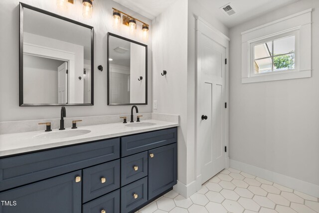 1005 Forrestal Pl, Durham, NC 27707 - bathroom featuring double vanity and tile patterned floors