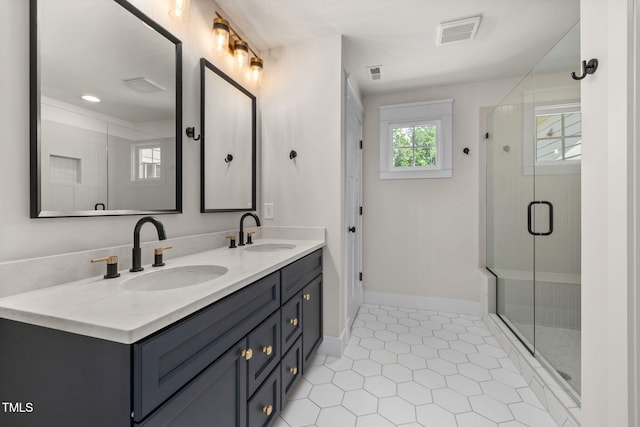 1005 Forrestal Pl, Durham, NC 27707 - full bath featuring double vanity, a shower stall, and tile patterned flooring