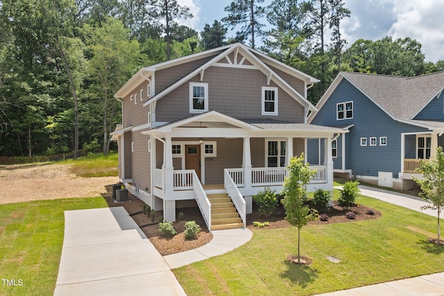 1005 Forrestal Pl, Durham, NC 27707 - view of front of property with a porch, a front yard, and stairs