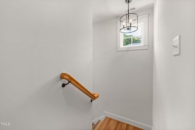 1005 Forrestal Pl, Durham, NC 27707 - staircase with a chandelier and wood finished floors