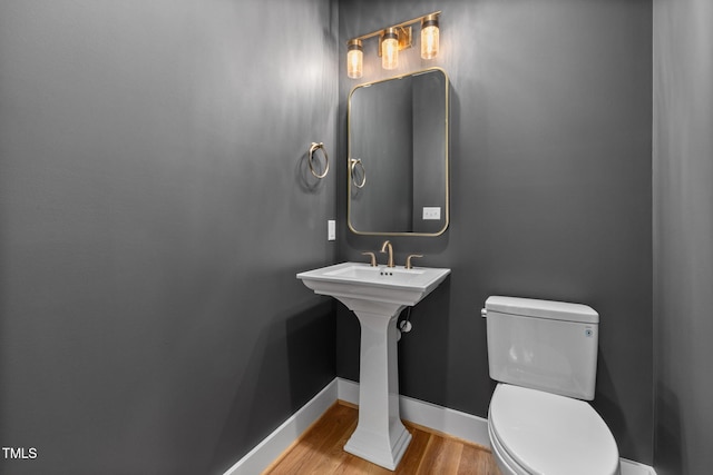 1005 Forrestal Pl, Durham, NC 27707 - half bathroom featuring baseboards and wood finished floors