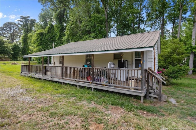 3042 Overhills Rd, Bunnlevel, NC 28323 - view of front facade with metal roof and a front yard