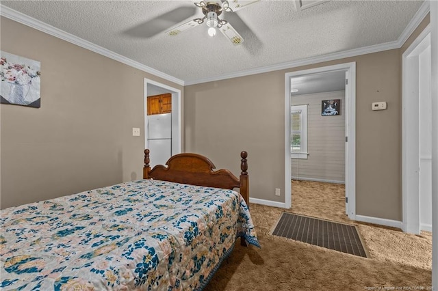 3042 Overhills Rd, Bunnlevel, NC 28323 - bedroom with freestanding refrigerator, carpet floors, crown molding, a textured ceiling, and baseboards