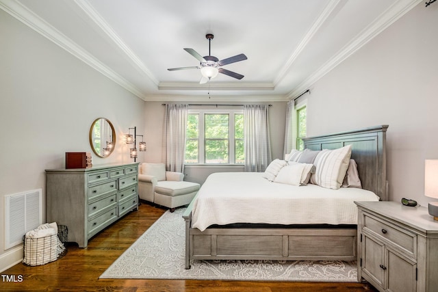 bedroom featuring ornamental molding, multiple windows, visible vents, and dark wood-type flooring