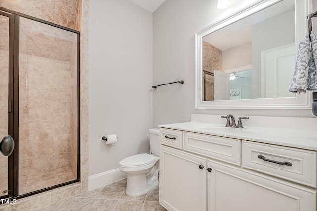 bathroom featuring vanity, toilet, and a shower stall
