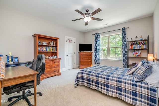 carpeted bedroom with visible vents, baseboards, and ceiling fan