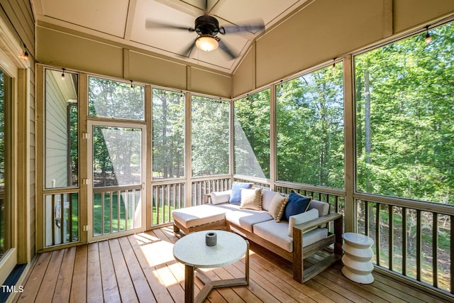 sunroom / solarium with ceiling fan and outdoor lounge area