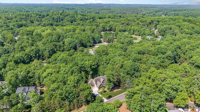 aerial view featuring a wooded view