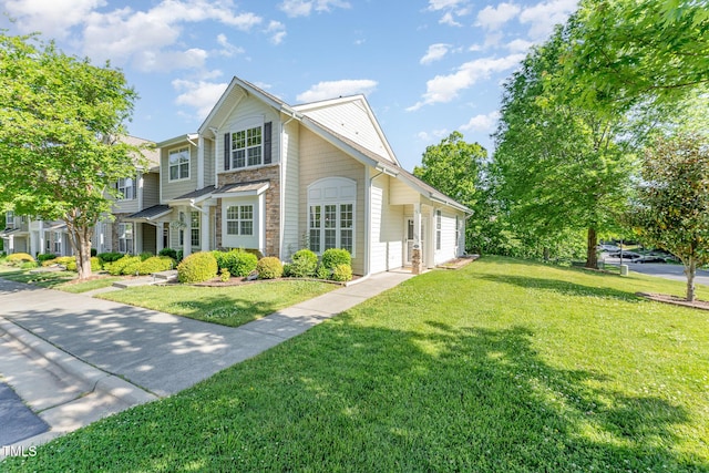 view of front of property with stone siding and a front yard