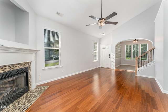 unfurnished living room featuring baseboards, a ceiling fan, wood finished floors, and visible vents