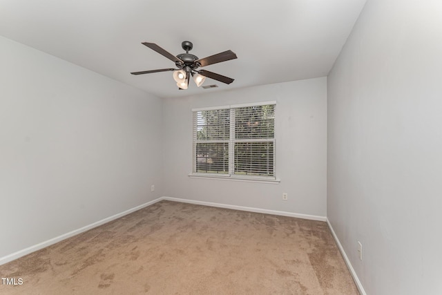 empty room with baseboards, carpet flooring, and ceiling fan