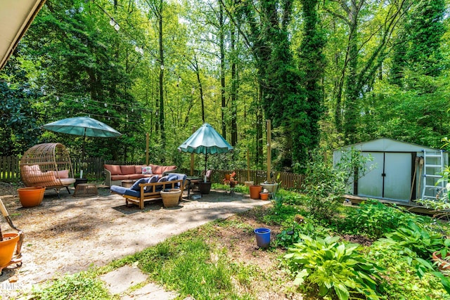 7313 Longstreet Dr, Raleigh, NC 27615 - view of yard featuring a fenced backyard, an outdoor living space, a patio area, and a shed