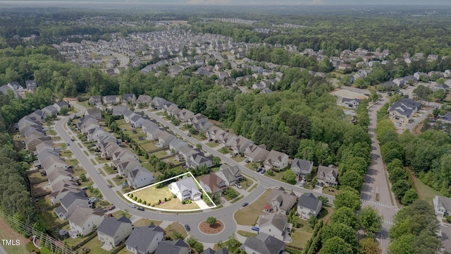 bird's eye view with a residential view and a view of trees