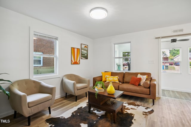 living room with light wood-style floors and baseboards