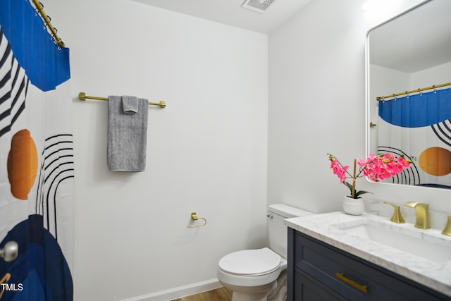 full bathroom with vanity, toilet, baseboards, wood finished floors, and a shower with shower curtain
