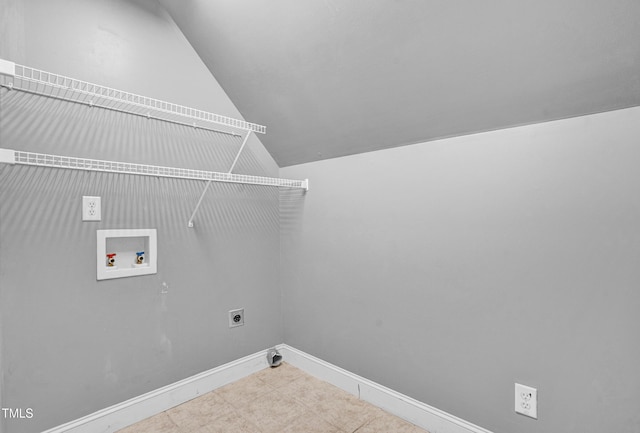 clothes washing area with hookup for an electric dryer, laundry area, baseboards, hookup for a washing machine, and tile patterned flooring
