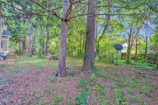 view of yard with a forest view