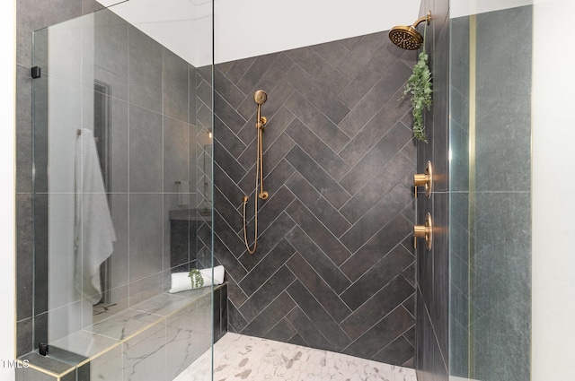 full bath featuring a tile shower