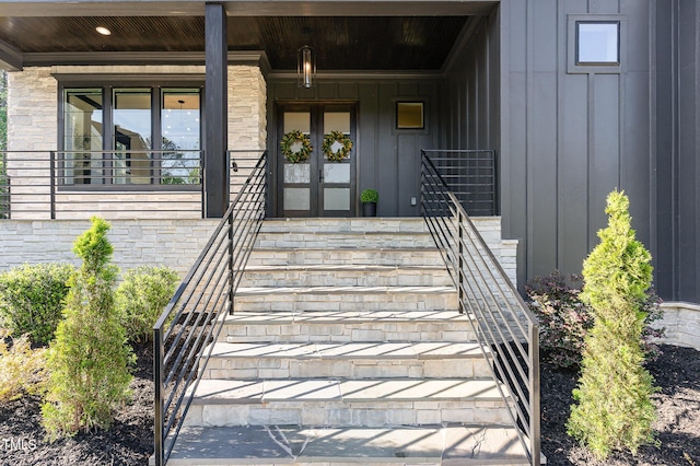 doorway to property featuring board and batten siding and a porch