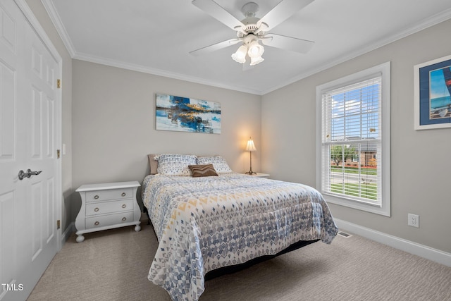 bedroom featuring crown molding, baseboards, and dark colored carpet